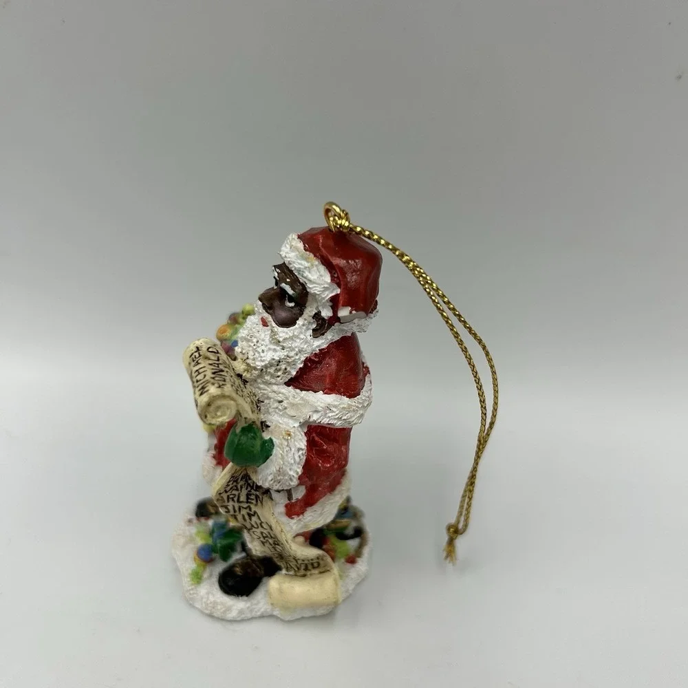 The International‎ Santa Claus Collection 1997 African American Santa Flawed